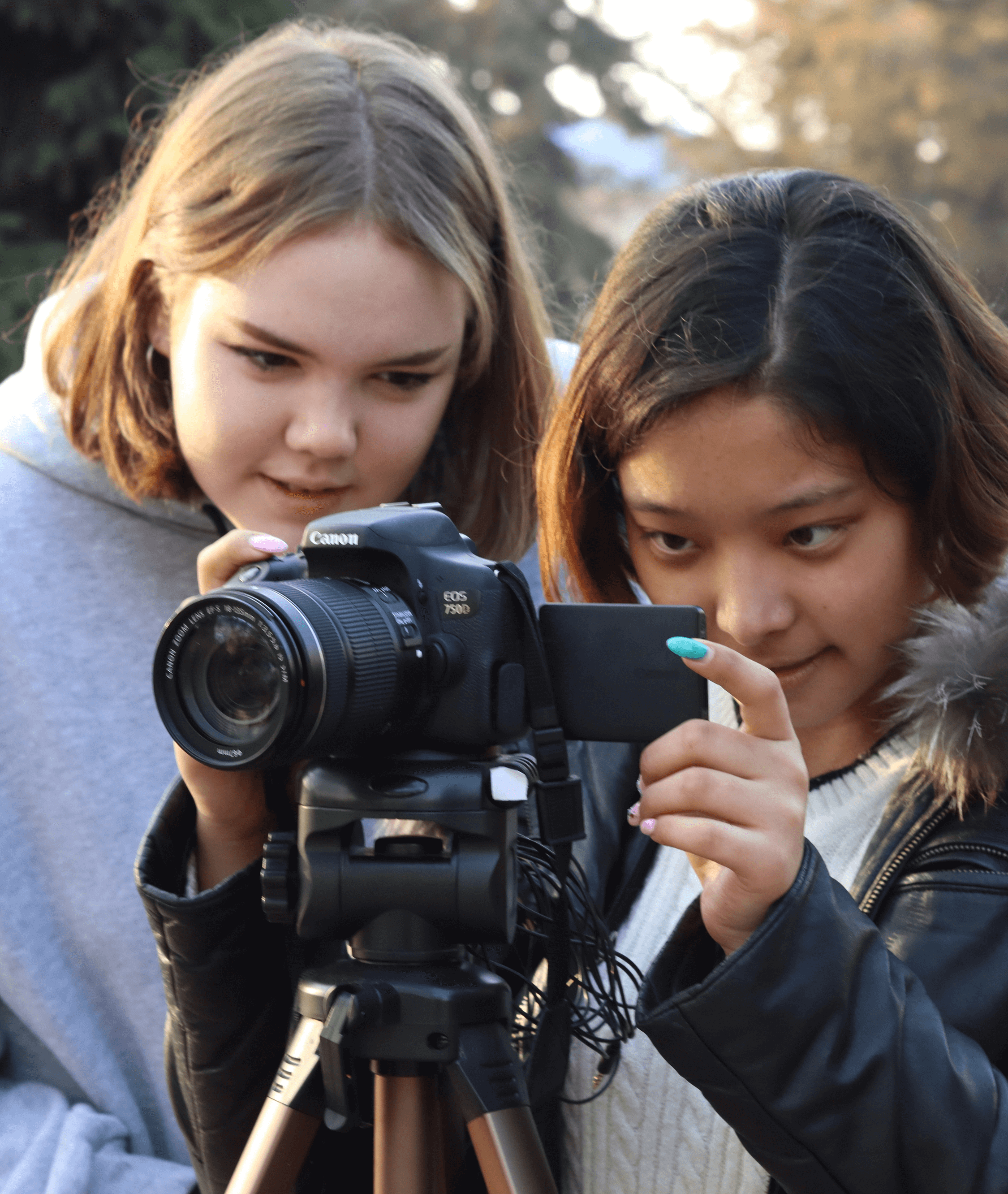 Two students with a camera